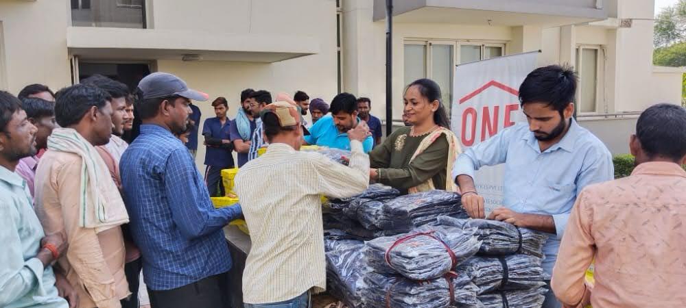 Workers lining up at a winter clothing drive